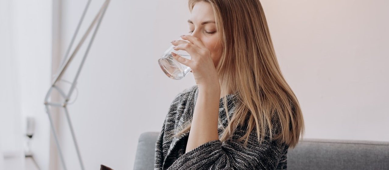 Woman Drinking Water | Breast Cancer Car Donations