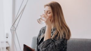 Woman Drinking Water | Breast Cancer Car Donations