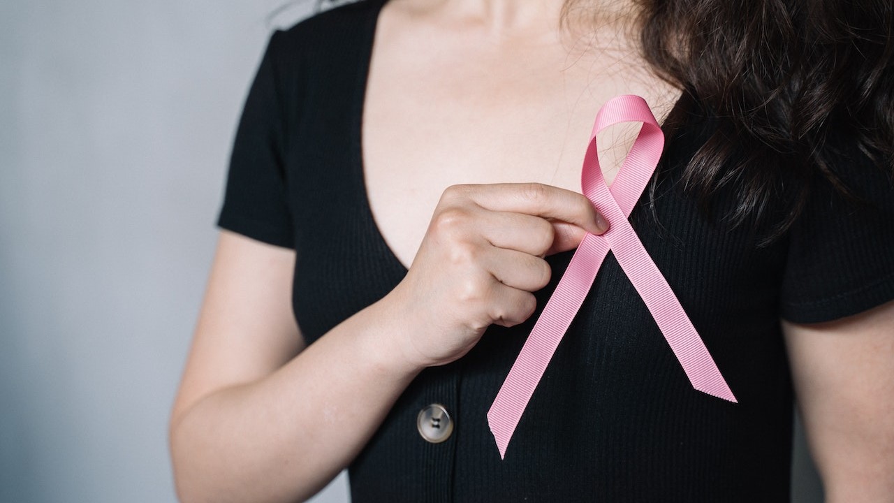 Woman Holding Pink Ribbon 