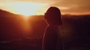 Silhouette Photography of Woman at Golden Hour | Breast Cancer Car Donations