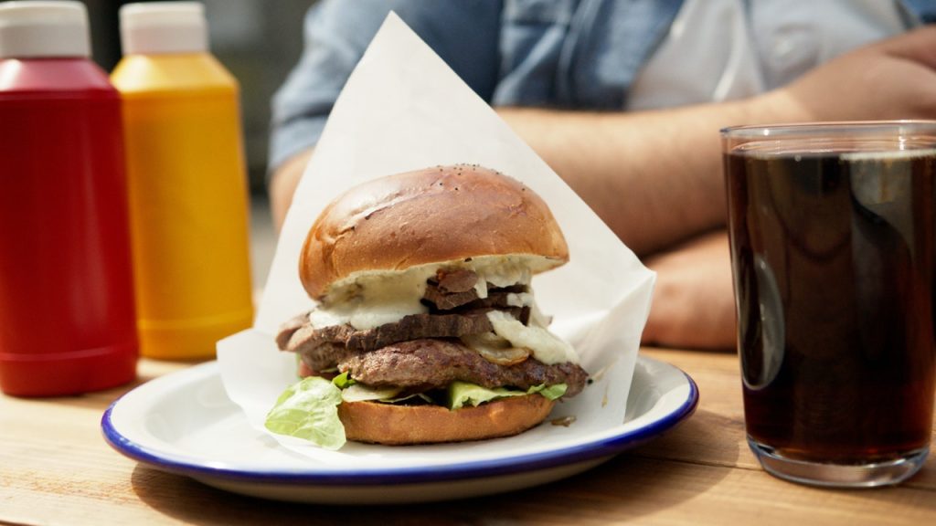 Burger With Lettuce and Cheese on White Paper | Breast Cancer Car Donations