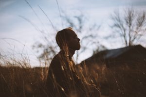 Person Meditating Outdoors | Breast Cancer Car Donations