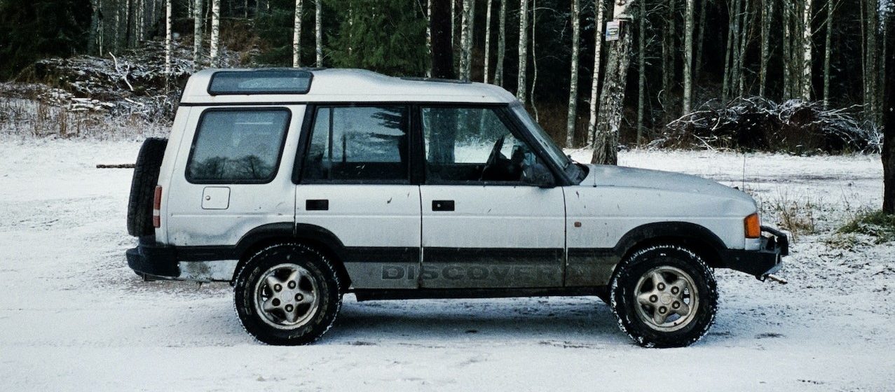 White SUV on Snow Covered Road | Breast Cancer Car Donations