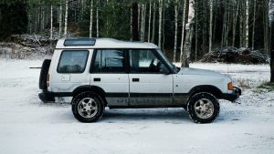 White SUV on Snow Covered Road | Breast Cancer Car Donations