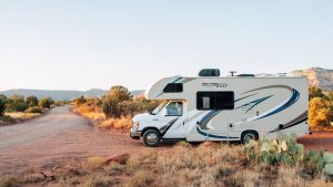 White and brown rv on brown grass | Breast Cancer Car Donations