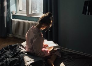 Woman Reading in Morning | Breast Cancer Car Donations