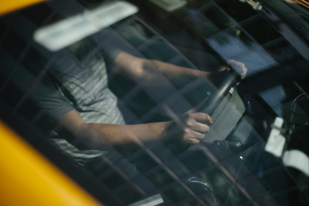 Person on a Steering Wheel | Breast Cancer Car Donations