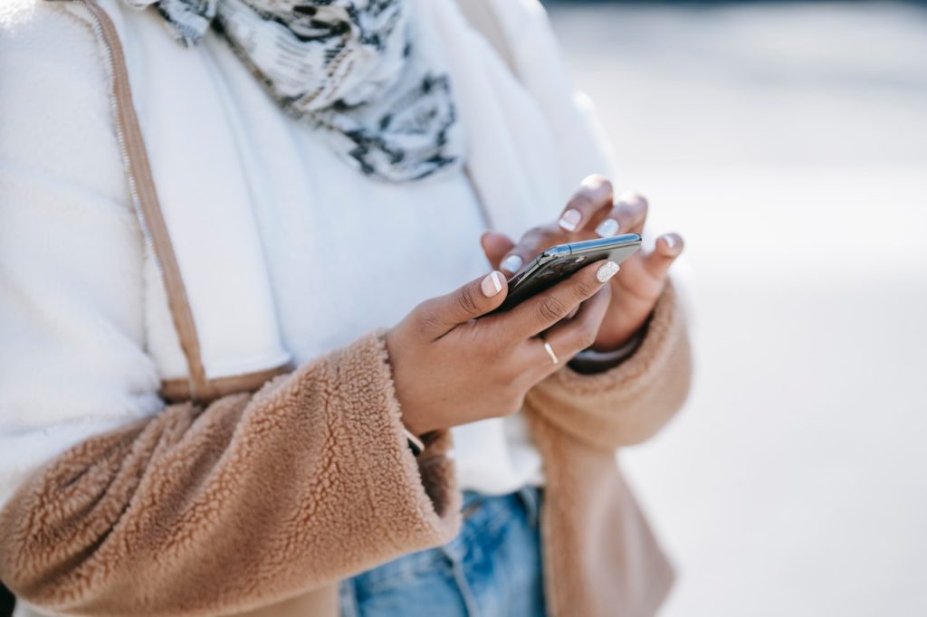 Woman Using a Smartphone | Breast Cancer Car Donations