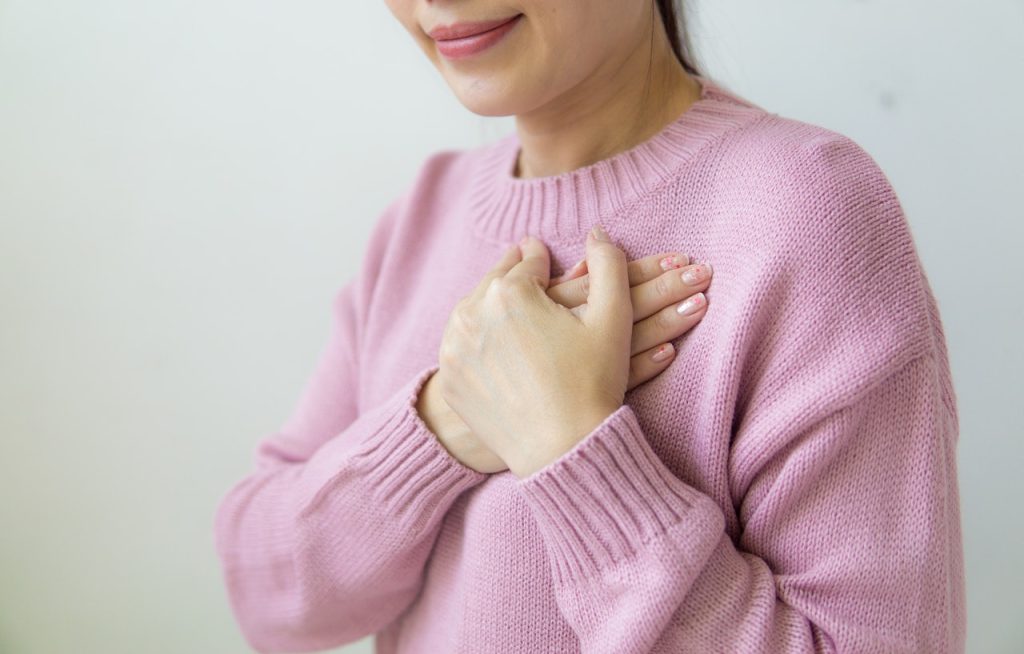 Woman Wearing Pink Sweatshirt | Breast Cancer Car Donations