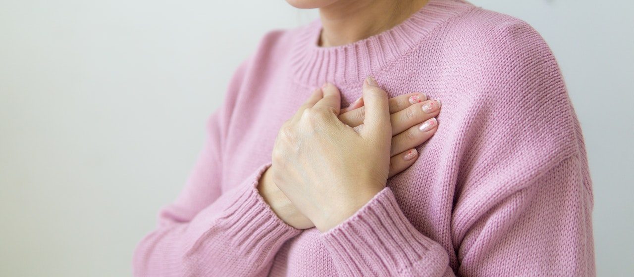 Woman Wearing Pink Sweatshirt | Breast Cancer Car Donations