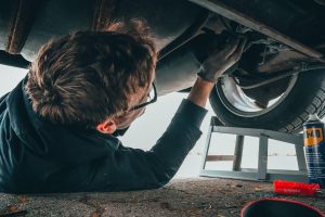 Person Taking Time Checking Car | Breast Cancer Car Donations