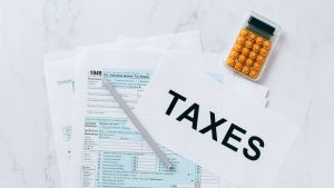Tax Documents on the Table | Breast Cancer Car Donations