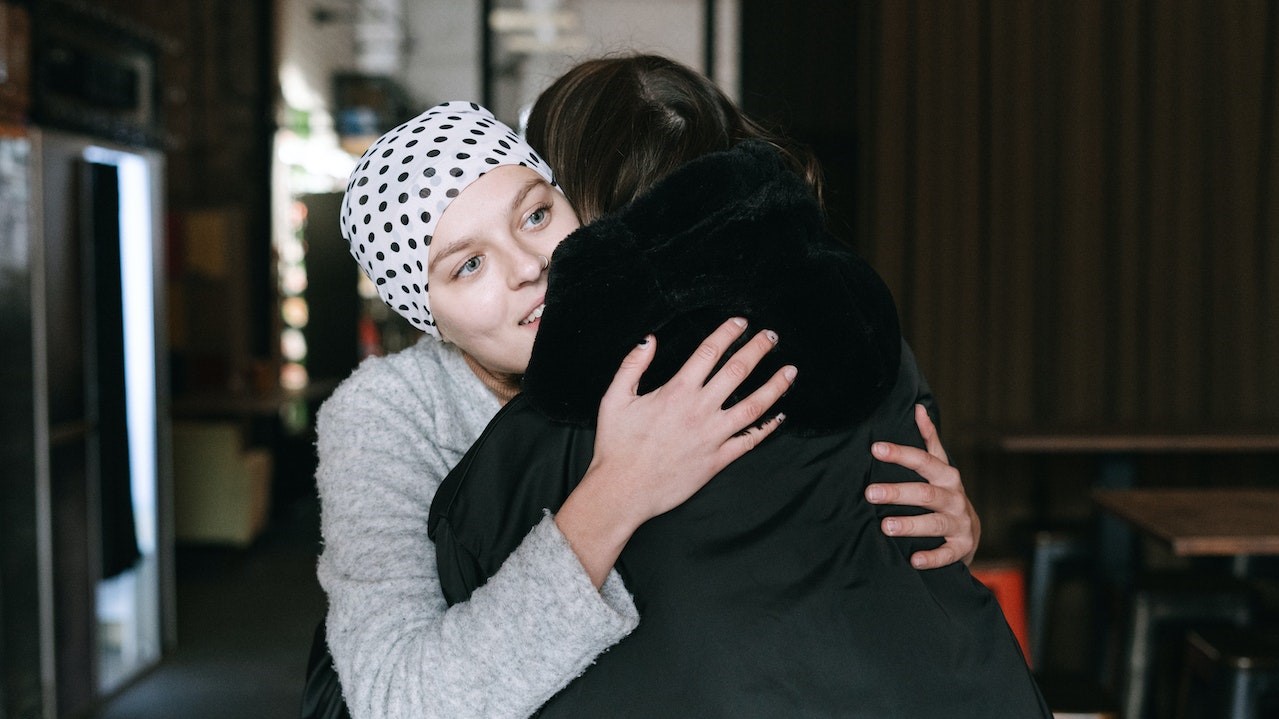 Close-Up Shot of Two People Hugging Each Other | Breast Cancer Car Donations