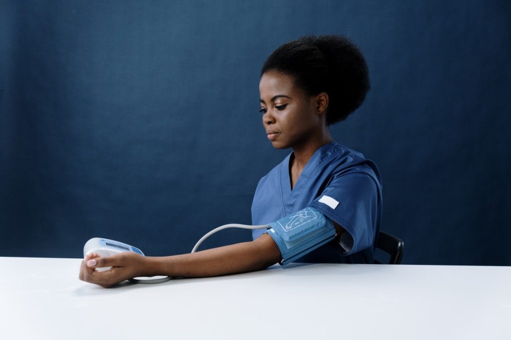 Woman Checking Blood Pressure | Breast Cancer Car Donations