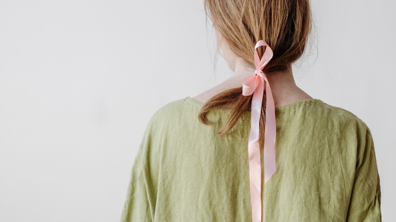 Back View of Woman in Green Dress | Breast Cancer Car Donations