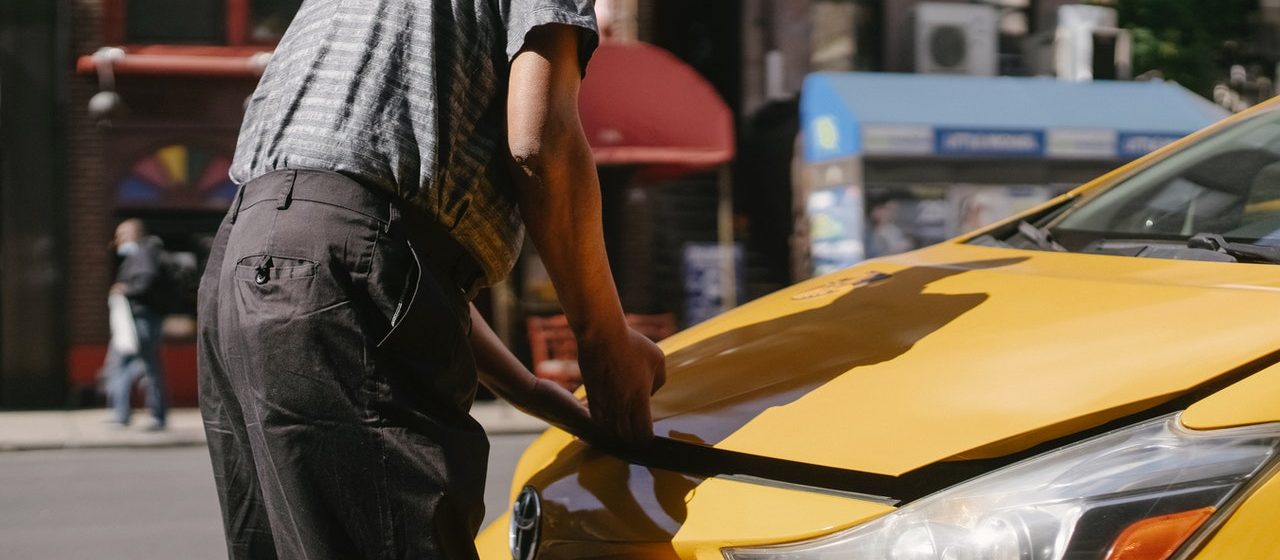 Person Opening Car Hood | Breast Cancer Car Donations