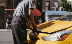 Person Opening Car Hood | Breast Cancer Car Donations