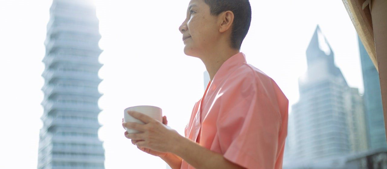 Short haired happy Asian woman with breast cancer enjoying tea | Breast Cancer Car Donations