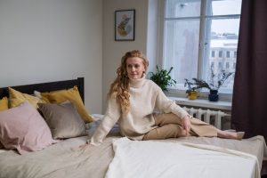 Woman Relaxed on a Bed | Breast Cancer Car Donations