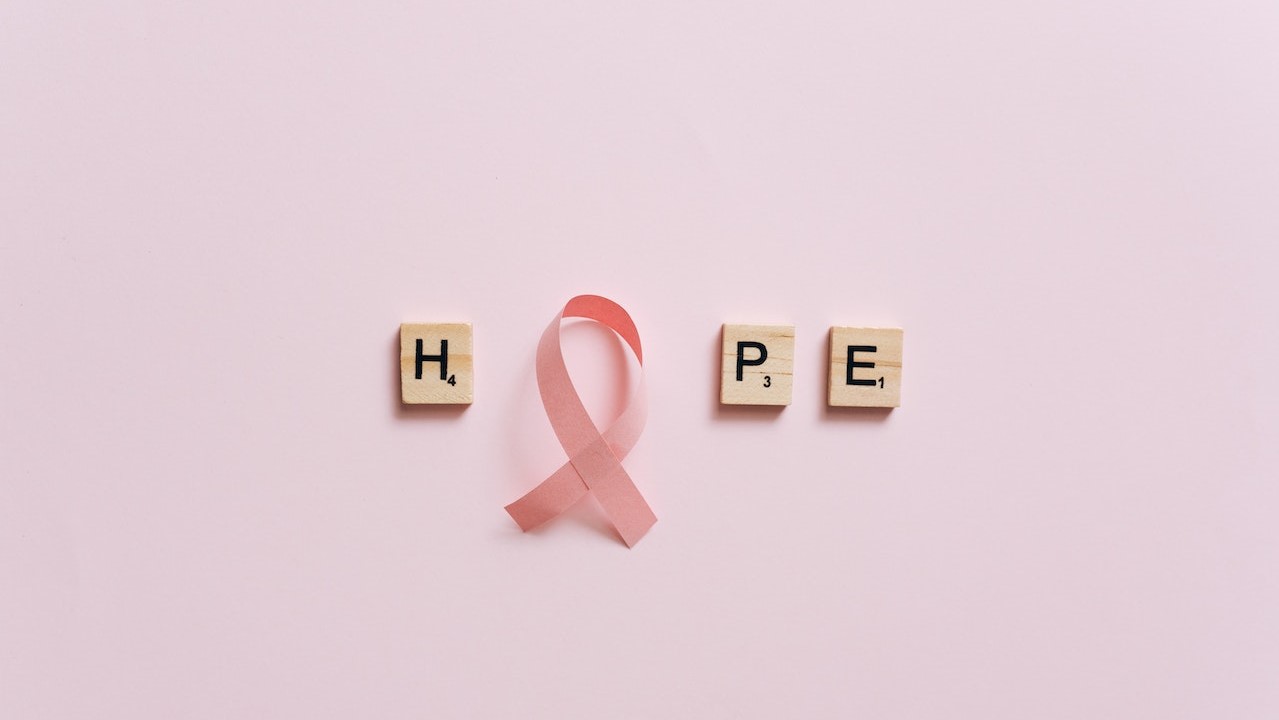 A Pink Ribbon on a Pink Surface with Message | Breast Cancer Car Donations