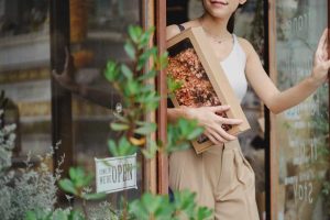 Woman Receiving Box Of Flowers | Breast Cancer Car Donations