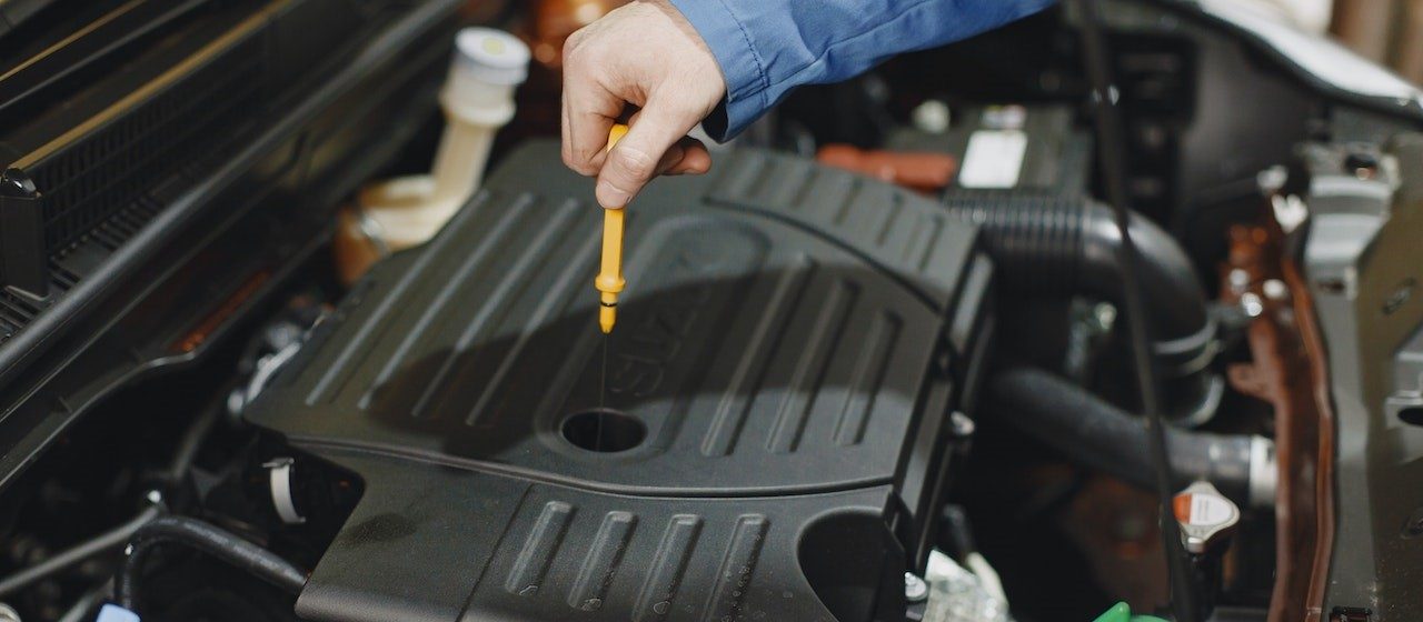 Checking the Oil of an Engine | Breast Cancer Car Donations