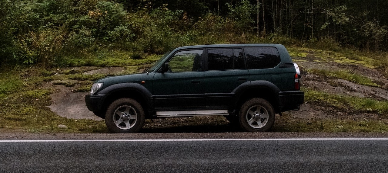 Black Vehicle Parked on Roadside | Breast Cancer Car Donations