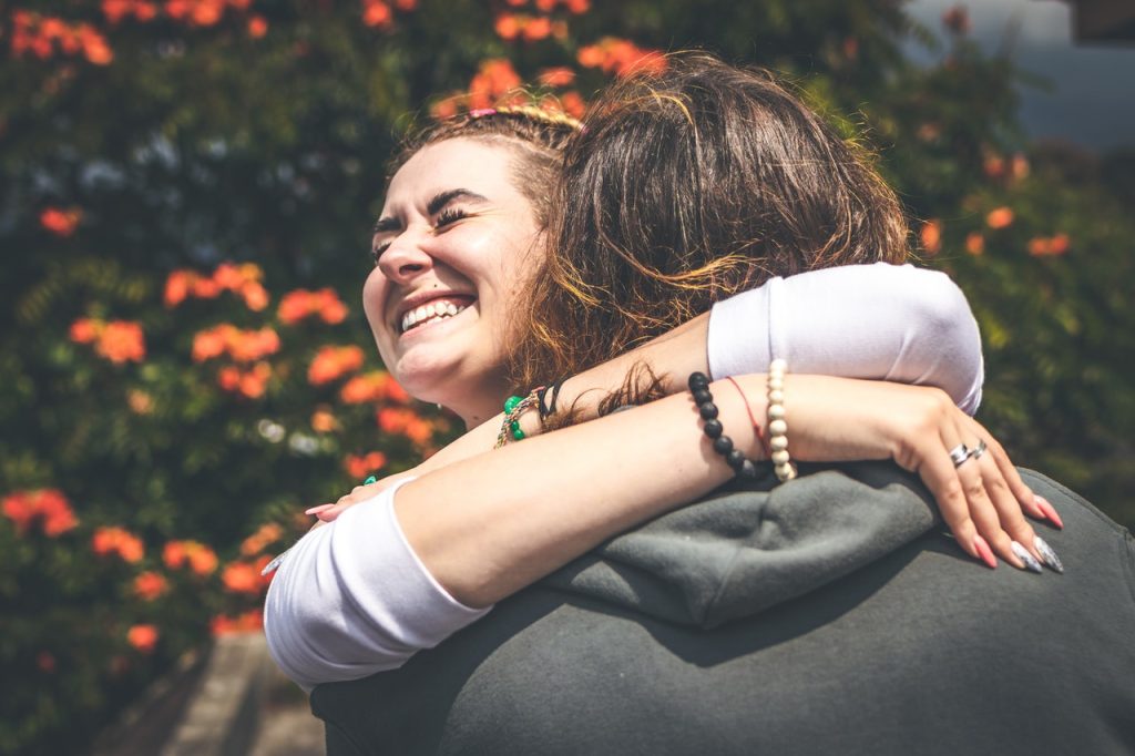 People Hugging Each Other | Breast Cancer Car Donations