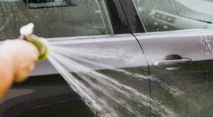 Person Washing a Car | Breast Cancer Car Donations