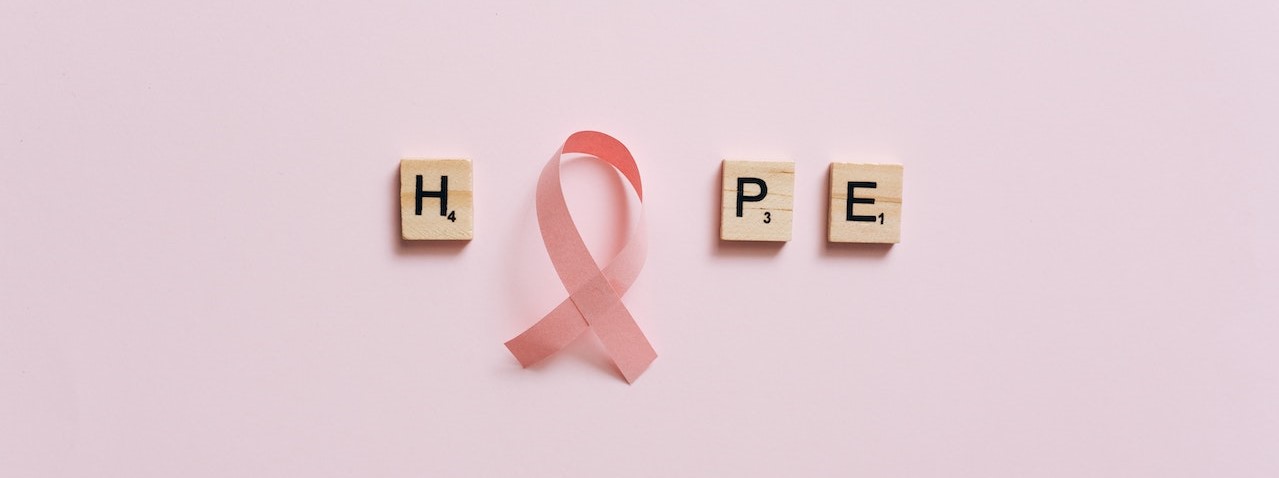 Pink Ribbon on a Pink Surface with Message | Breast Cancer Car Donations