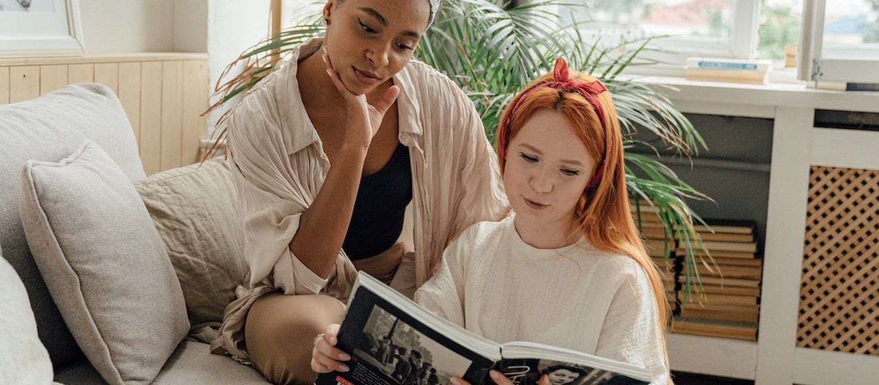 Two Women Looking at a Magazine | Breast Cancer Car Donations