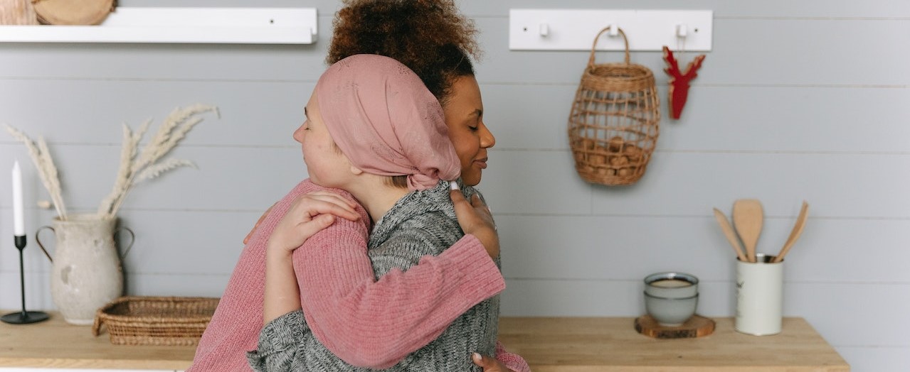 Woman Hugging a Friend | Breast Cancer Car Donations