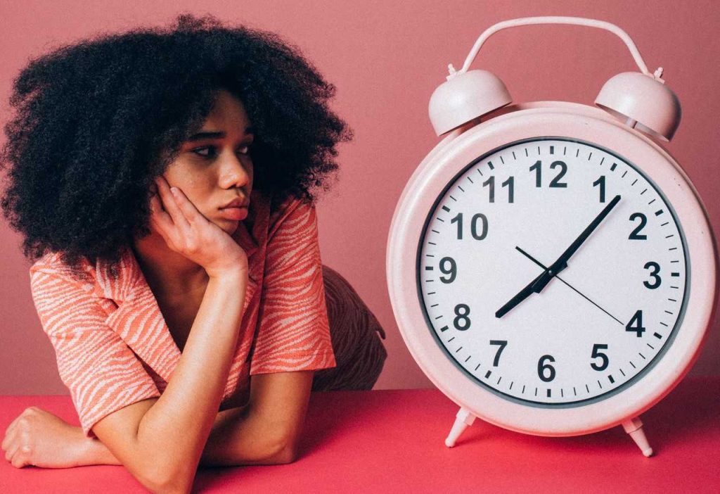Woman Looking at a Clock | Breast Cancer Car Donations