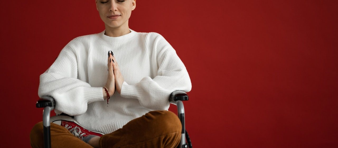 Woman on Wheelchair Meditating | Breast Cancer Car Donations