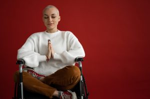 Woman on Wheelchair Meditating | Breast Cancer Car Donations