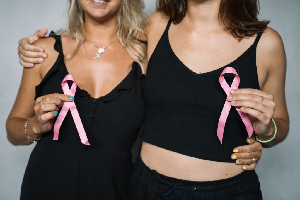 Women Holding Pink Ribbons | Breast Cancer Car Donations