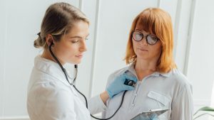 Doctor Checking Up Her Patient | Breast Cancer Car Donations