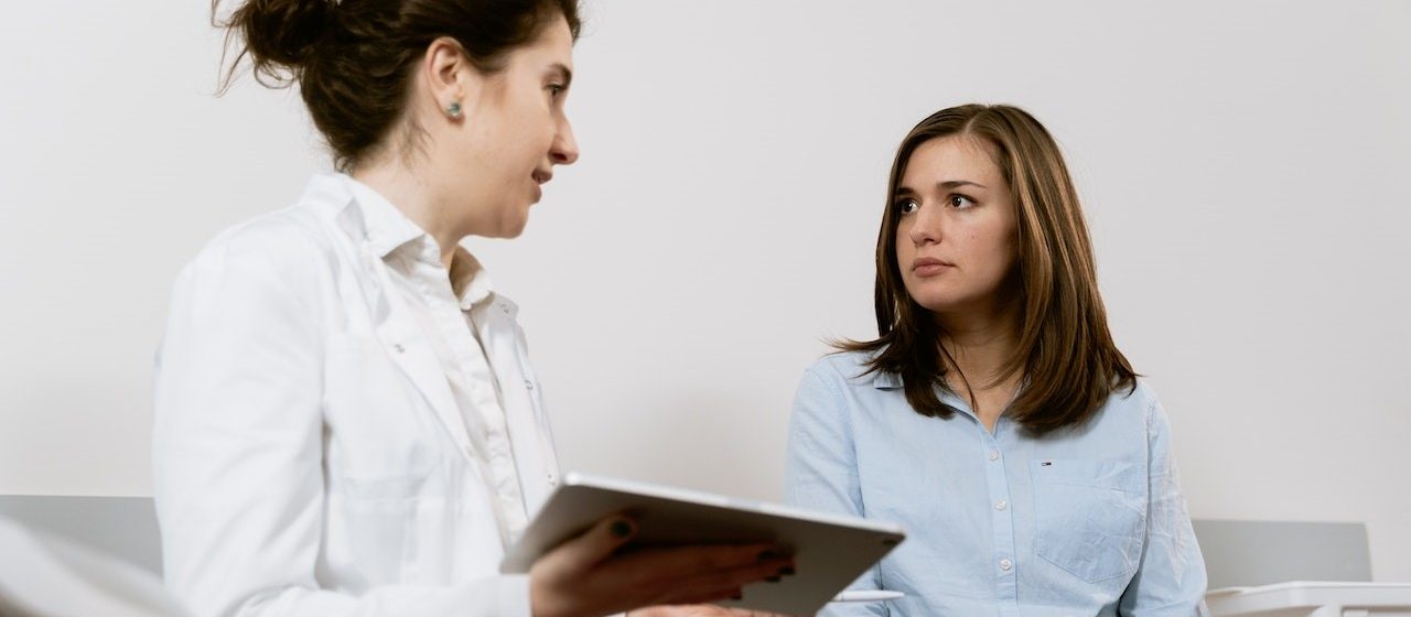 Doctor Explaining to Patient | Breast Cancer Car Donations