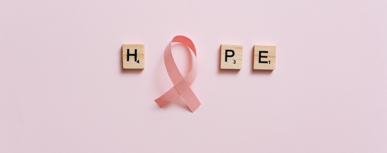 Pink Ribbon on a Pink Surface with Message | Breast Cancer Car Donations
