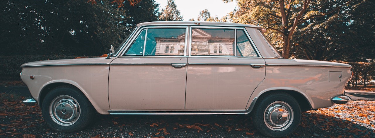 Pink Vintage Car Parked on the Street | Breast Cancer Car Donations