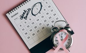 Shot of a Pink Ribbon beside a Calendar | Breast Cancer Car Donations