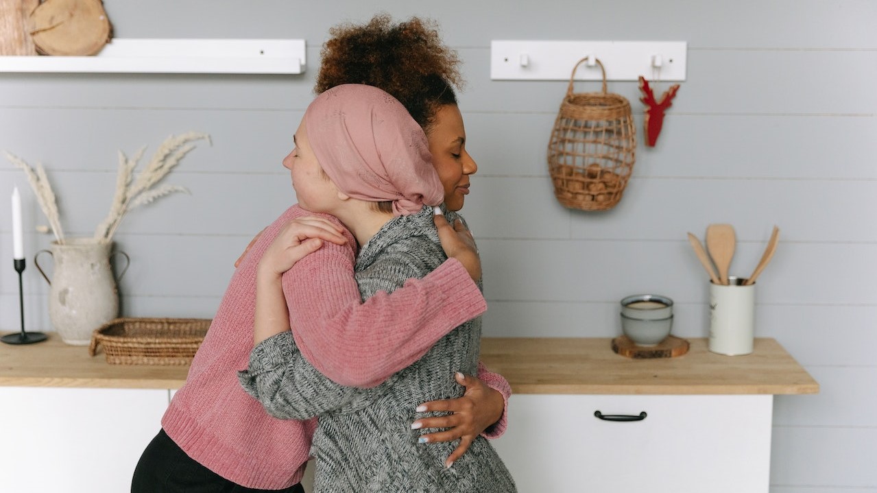 Woman Hugging Another Woman | Breast Cancer Car Donations