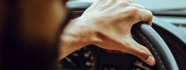 Person Holding the Steering Wheel | Breast Cancer Car Donations