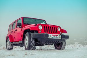 Red Jeep with Winter Tires On | Breast Cancer Car Donations