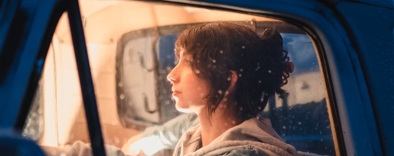 Woman Sitting in an Old Pick-up Truck in Winter | Breast Cancer Car Donations