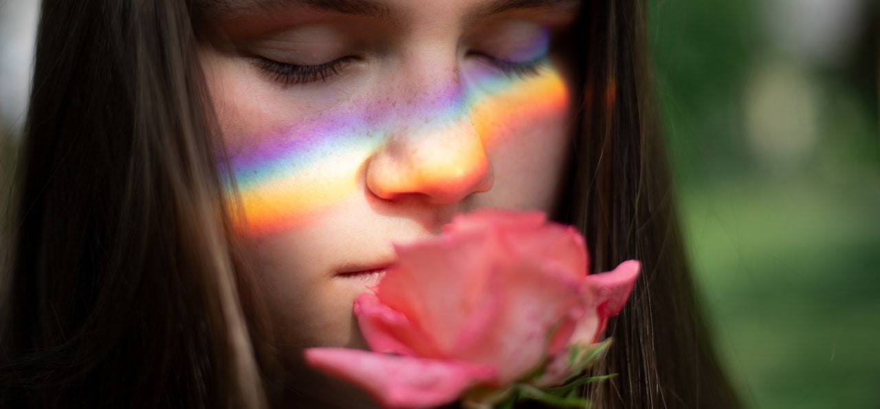 Photography of Woman Smelling Pink Rose | Breast Cancer Car Donations