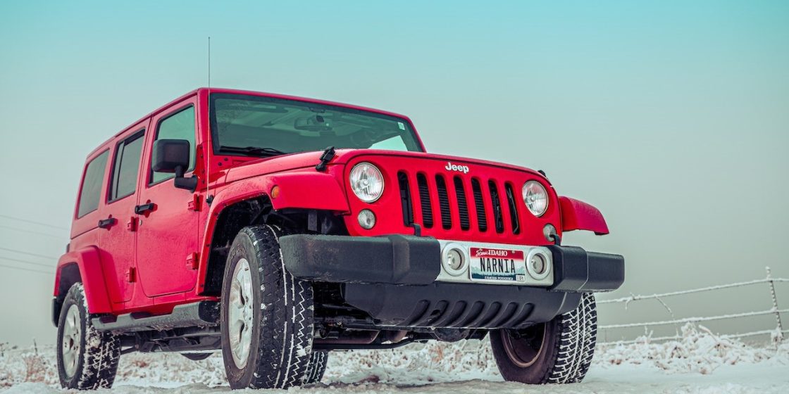 Red Suv on Snow Covered Ground | Breast Cancer Car Donations