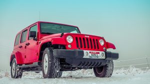 Red Suv on Snow Covered Ground | Breast Cancer Car Donations