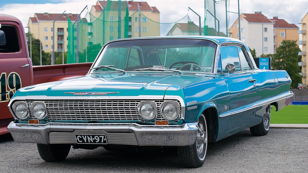 Classic Blue Coupe Parked Besides Red Pickup Truck | Breast Cancer Car Donations