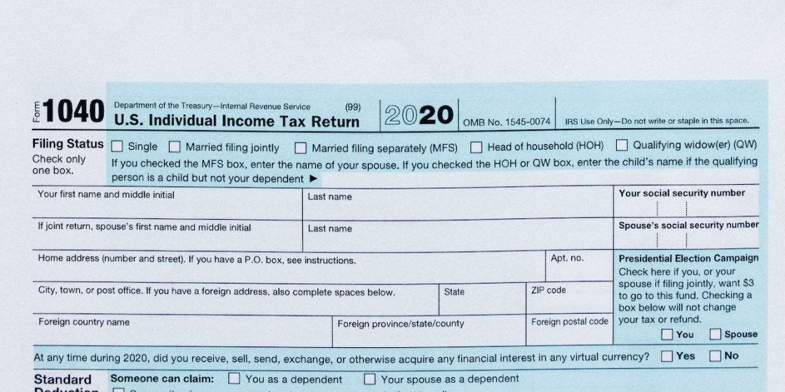 Tax Form on Black Surface | Breast Cancer Car Donations